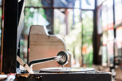 Close-up of old glass window on table