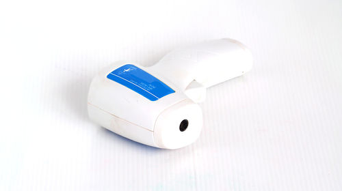 High angle view of information sign on white table