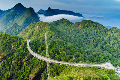 High angle view of bridge over tree mountains