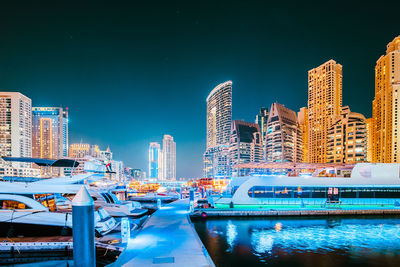 Illuminated buildings in city at night