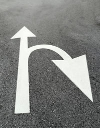 High angle view of arrow sign on road