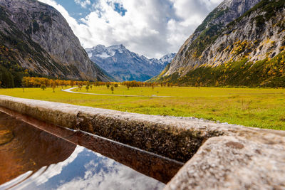 Scenic view of landscape and mountains against sky