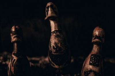 Close-up of statue against black background