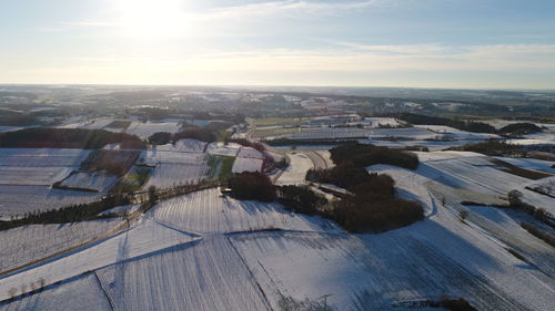 Aerial view of landscape against cloudy sky