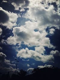 Scenic view of mountains against cloudy sky