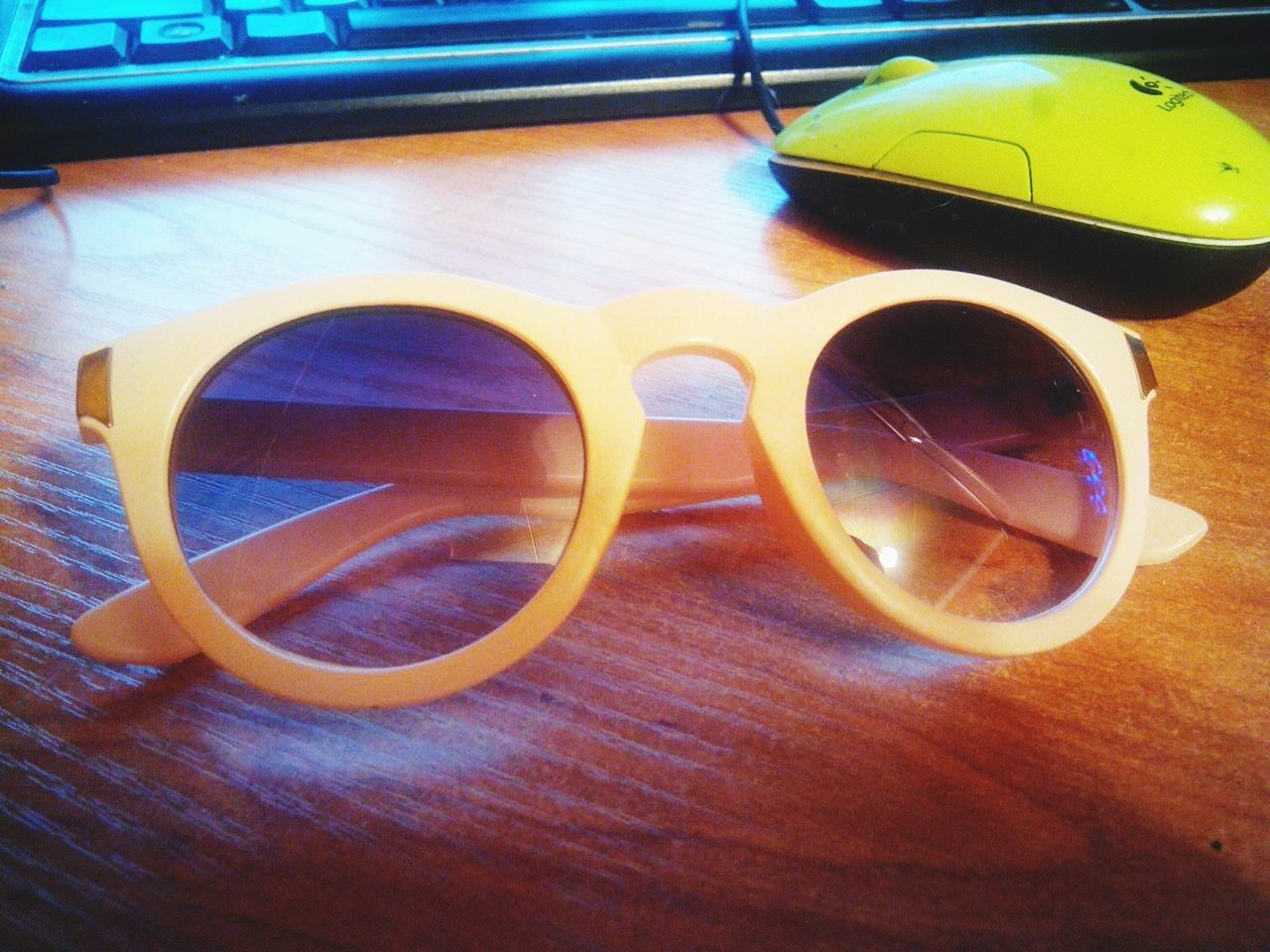 transportation, yellow, close-up, mode of transport, table, reflection, high angle view, indoors, still life, part of, no people, land vehicle, car, wood - material, cropped, single object, stationary, day, sunglasses