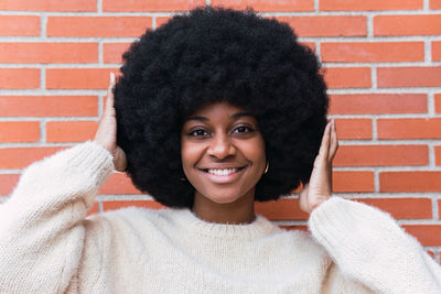 Portrait of young woman with curly hair