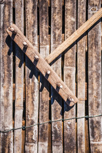 High angle view of wooden rake on planks