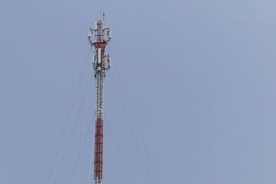 Low angle view of communications tower against clear sky