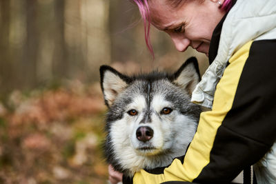 Midsection of man with dog