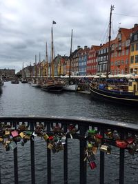 Boats moored in river