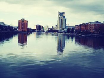 Buildings in city against sky