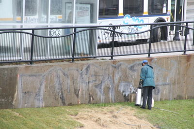 Rear view of man walking in city