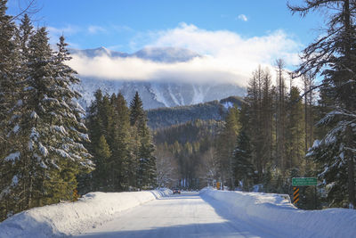 Scenic view of snow covered mountains against sky