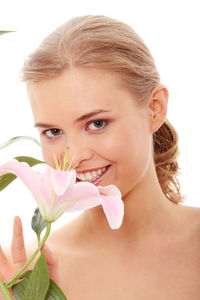 Close-up portrait of smiling young woman