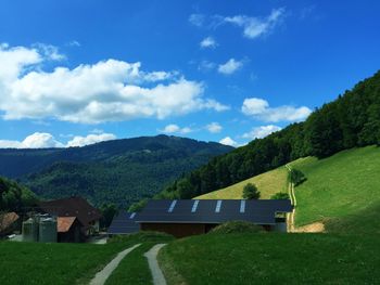 Scenic view of landscape and mountains against sky