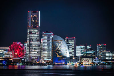 Illuminated buildings in city at night