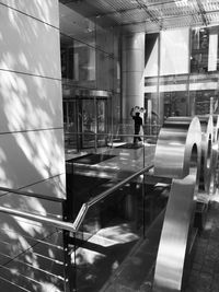 Reflection of man in airport