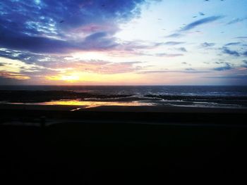 Scenic view of sea against sky at sunset