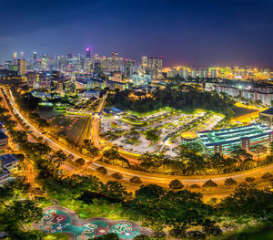 High angle view of illuminated buildings in city at night