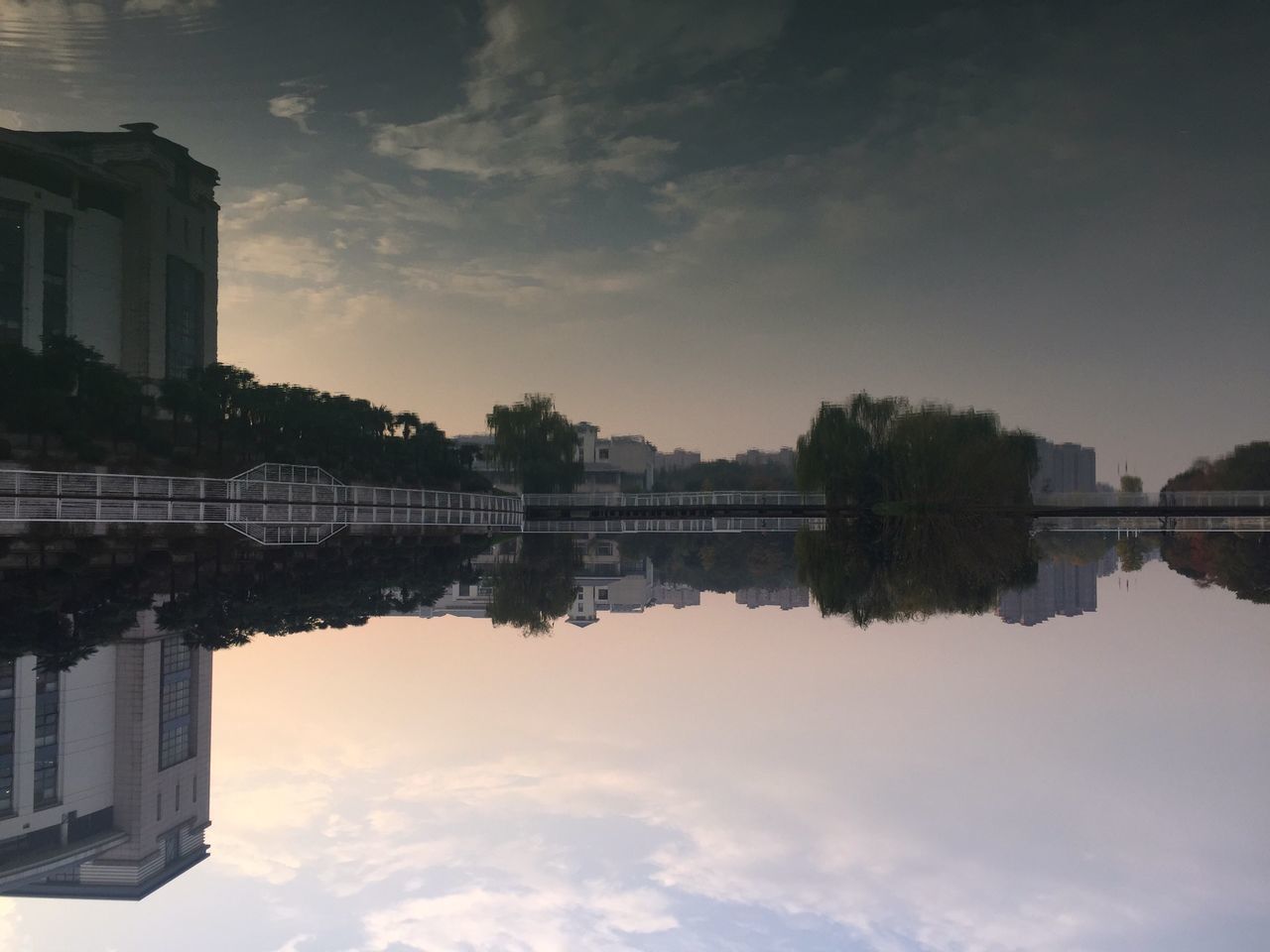 REFLECTION OF CITYSCAPE ON WATER