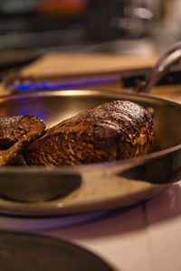 Roast beef baked in a silver frying pan