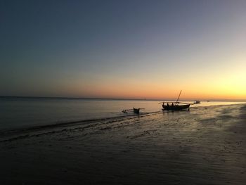 Scenic view of sea against clear sky during sunset