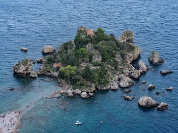 High angle view of rocks by sea