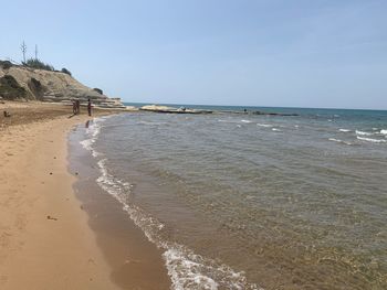 Scenic view of beach against clear sky