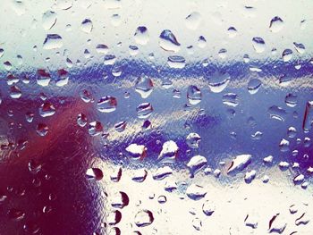 Close-up of water drops on glass window