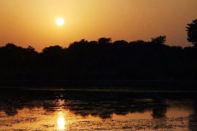 Scenic view of sunset over river