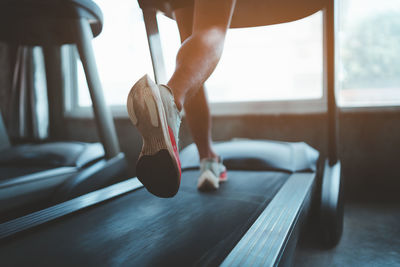 Low section of woman exercising in gym