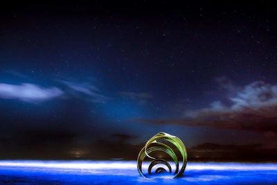 Light painting against sky at night