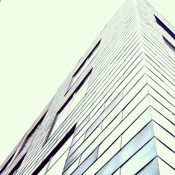 building exterior, architecture, built structure, low angle view, modern, office building, skyscraper, tall - high, clear sky, city, tower, building, window, day, glass - material, outdoors, tall, no people, sky, reflection