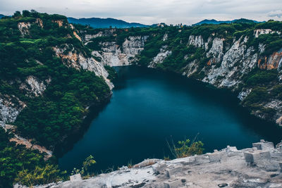 High angle view of stream amidst rocks