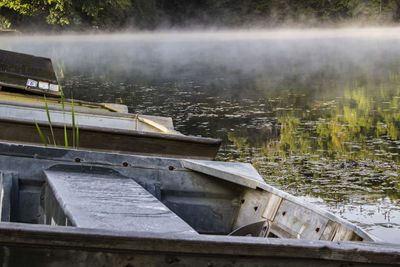 Boat moored by lake