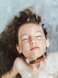 Close-up portrait of a woman with eyes closed