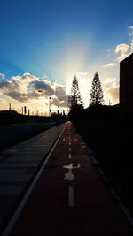 Road against sky at sunset
