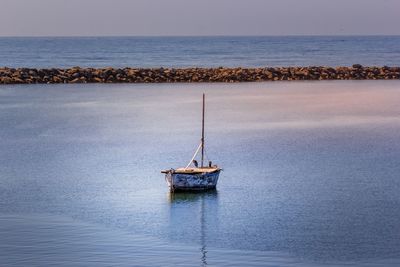 Ship in sea against sky