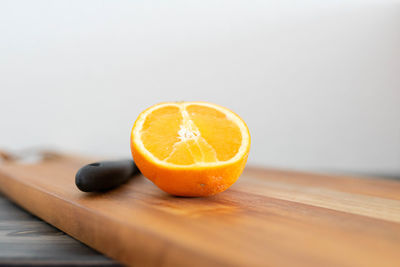 Close-up of orange slice on cutting board