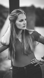 Portrait of beautiful young woman standing outdoors