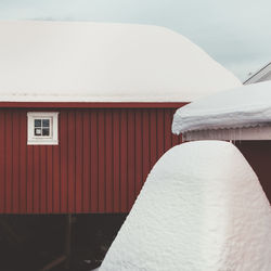 Close-up of building against sky during winter