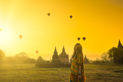 View of hot air balloons against sky during sunset