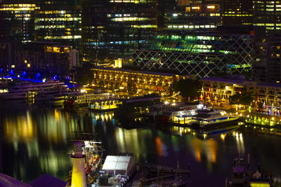 High angle view of illuminated buildings in city at night