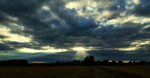 Scenic view of landscape against cloudy sky