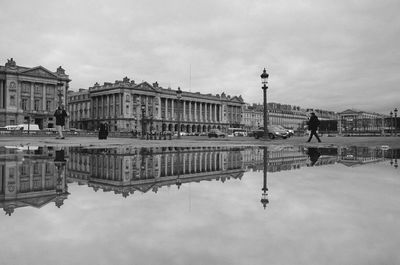 Reflection of historic buildings against sky