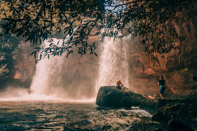 Scenic view of waterfall in sea