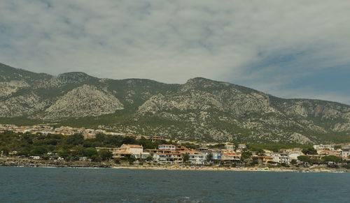 Townscape by sea against sky