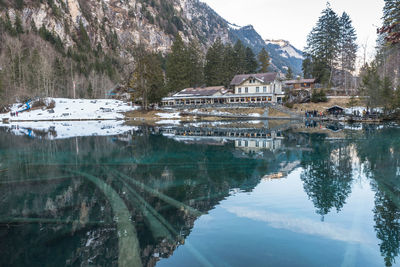 Reflection of trees in lake against sky