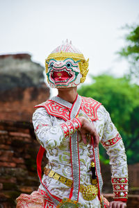 Full length of man wearing hat standing outdoors